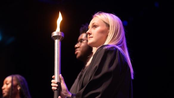 Young woman holding a torch