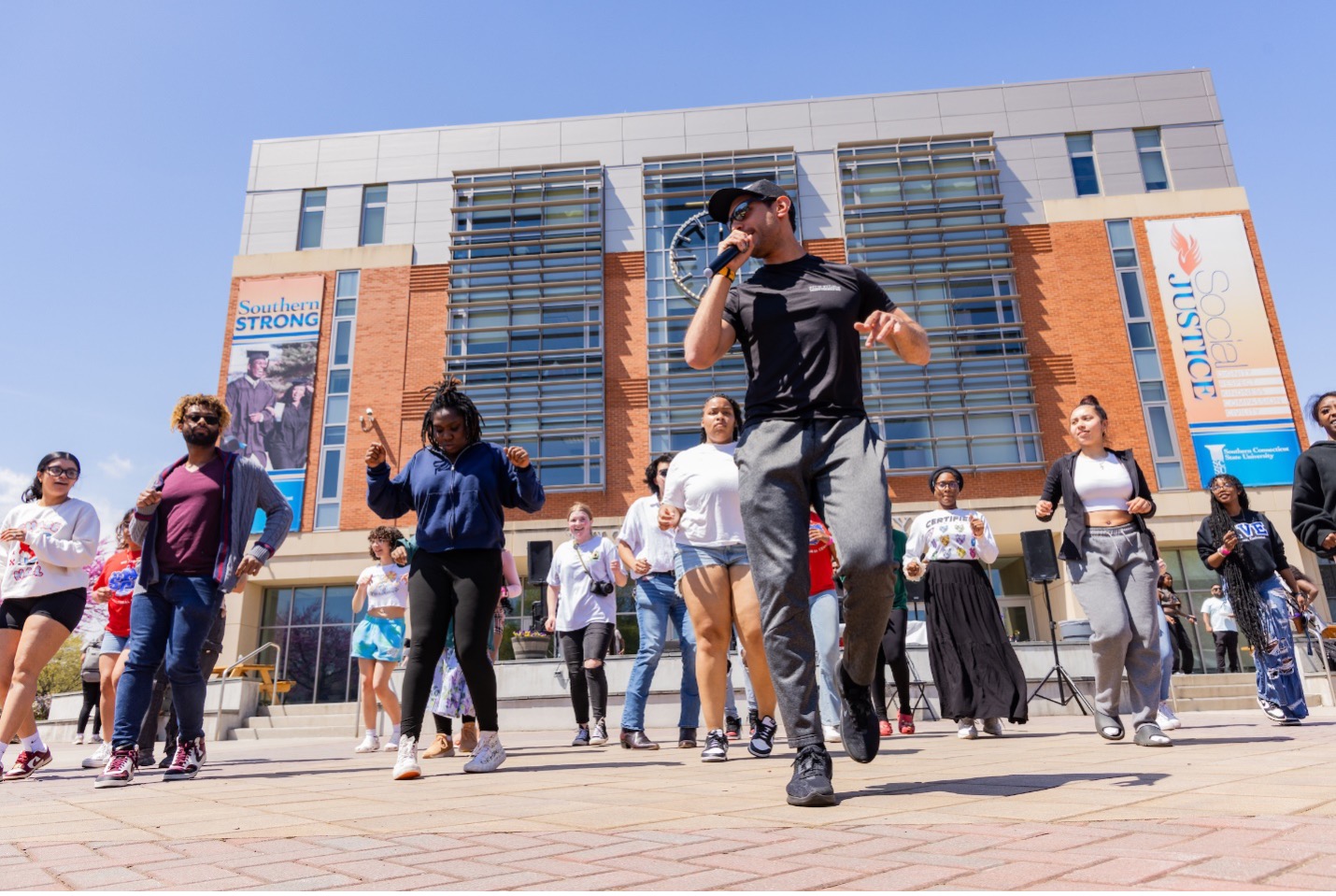 Students participating in a cultura heritage event with dancing.