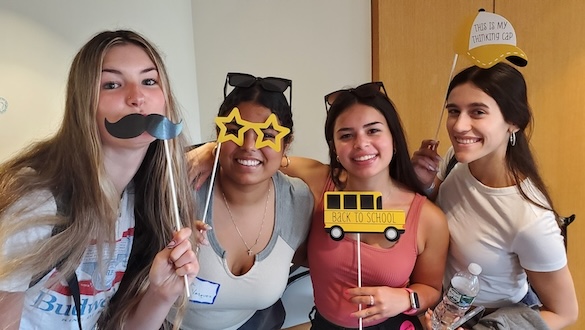 Students posing with decorations