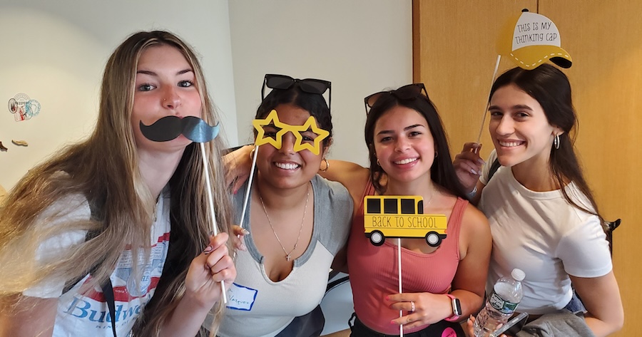 Students posing with fun decorations