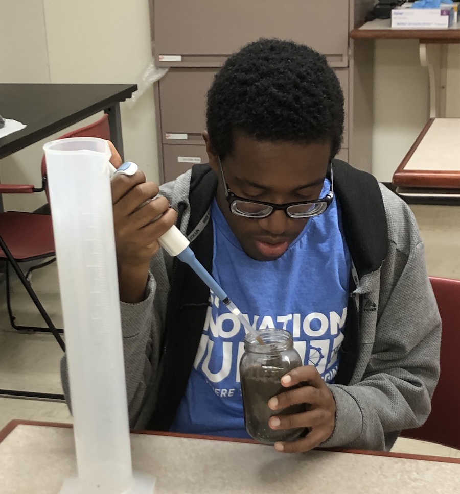 Student performing scientific tests