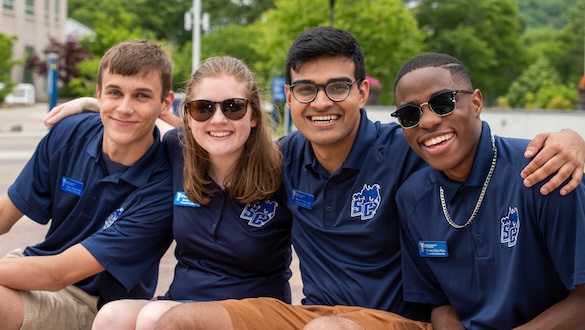 Students sitting together smiling