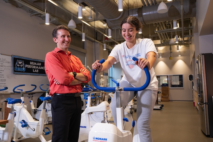 Heath and Human Services lab with professor and student on a bike