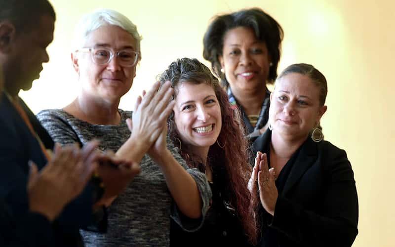 Julia Miller, SYC ’23 (center), was presented with the 2025 Connecticut Teacher of the Year award at the Metropolitan Business Academy in New Haven on October 16, 2024. (Photo: Arnold Gold)