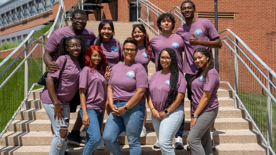 A group of students and teachers who are members of SEOP standing outside of Engleman Hall steps.