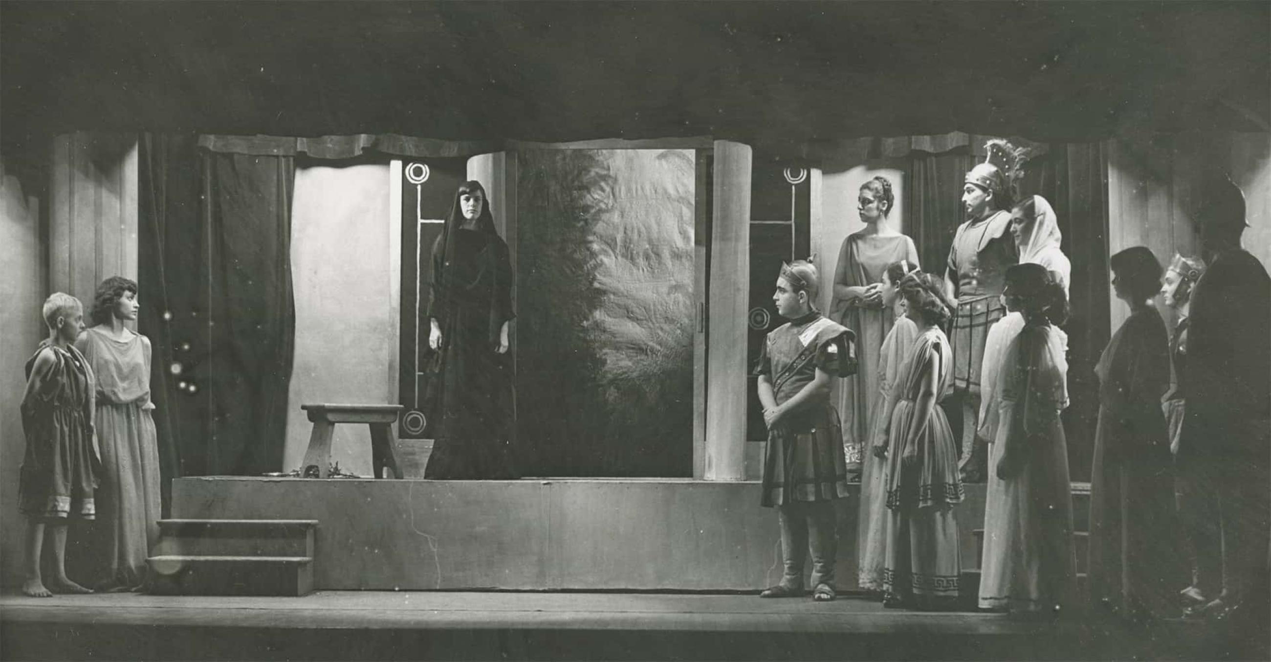 a black and white image of Crescent Players on stage in a production from many years ago