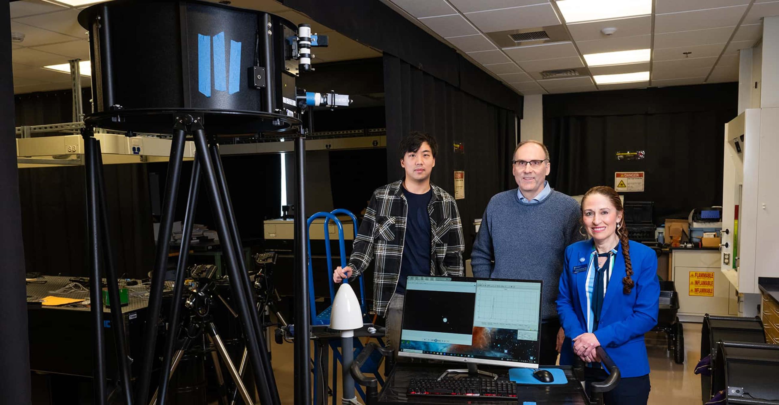 Applied physics graduate student Max Martone; Elliott Horch, Physics Department chair; and Physics Professor Christine Broadbridge, executive director of Research and Innovation, with the Southern Connecticut Stellar Interferometer, or SCSI 