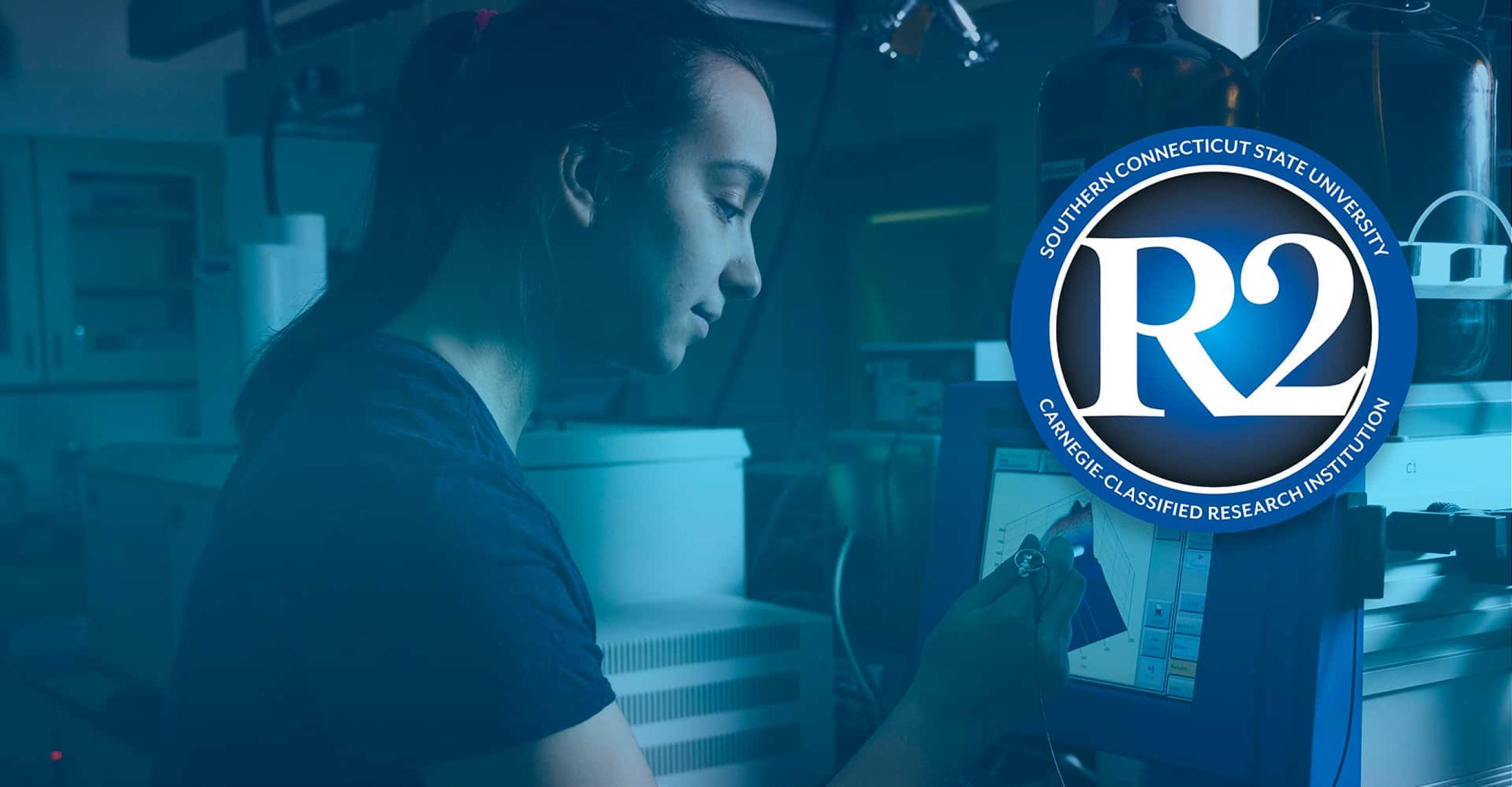 student works in a lab, with the R2 logo superimposed over the photo