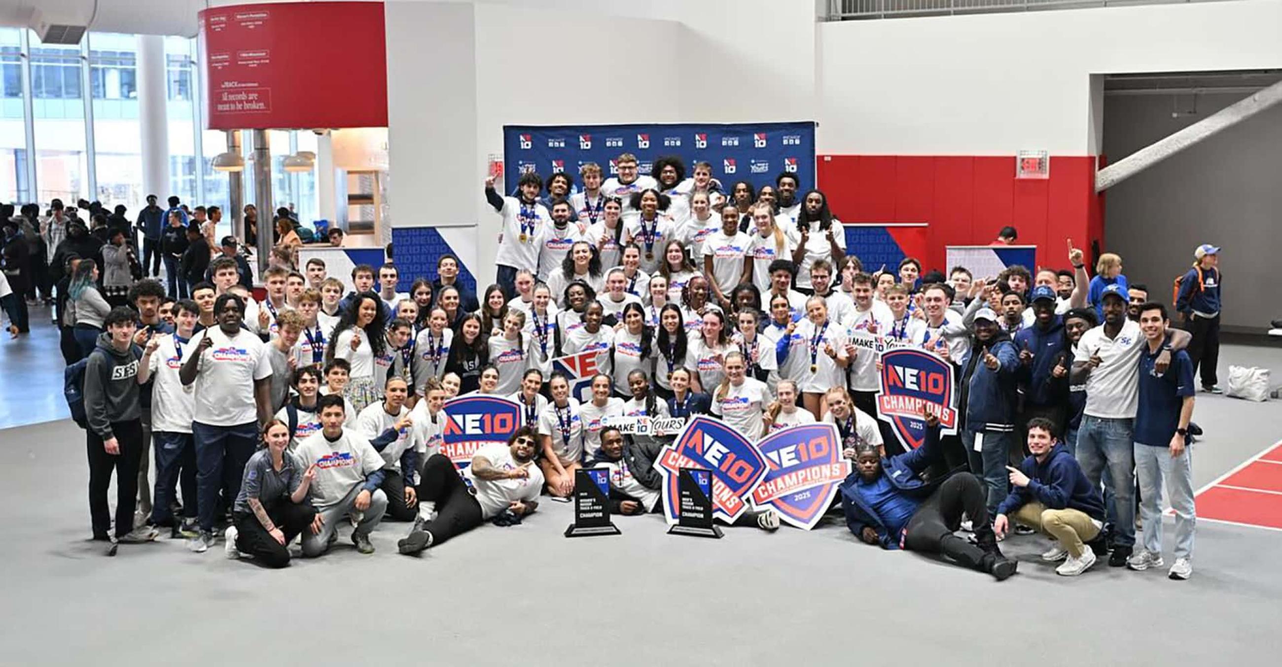 SCSU's Indoor Track and Field teams celebrate after winning the 2025 Northeast-10 Championships.