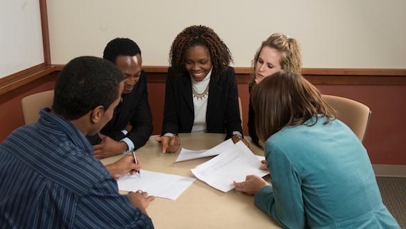 Students studying together around the table